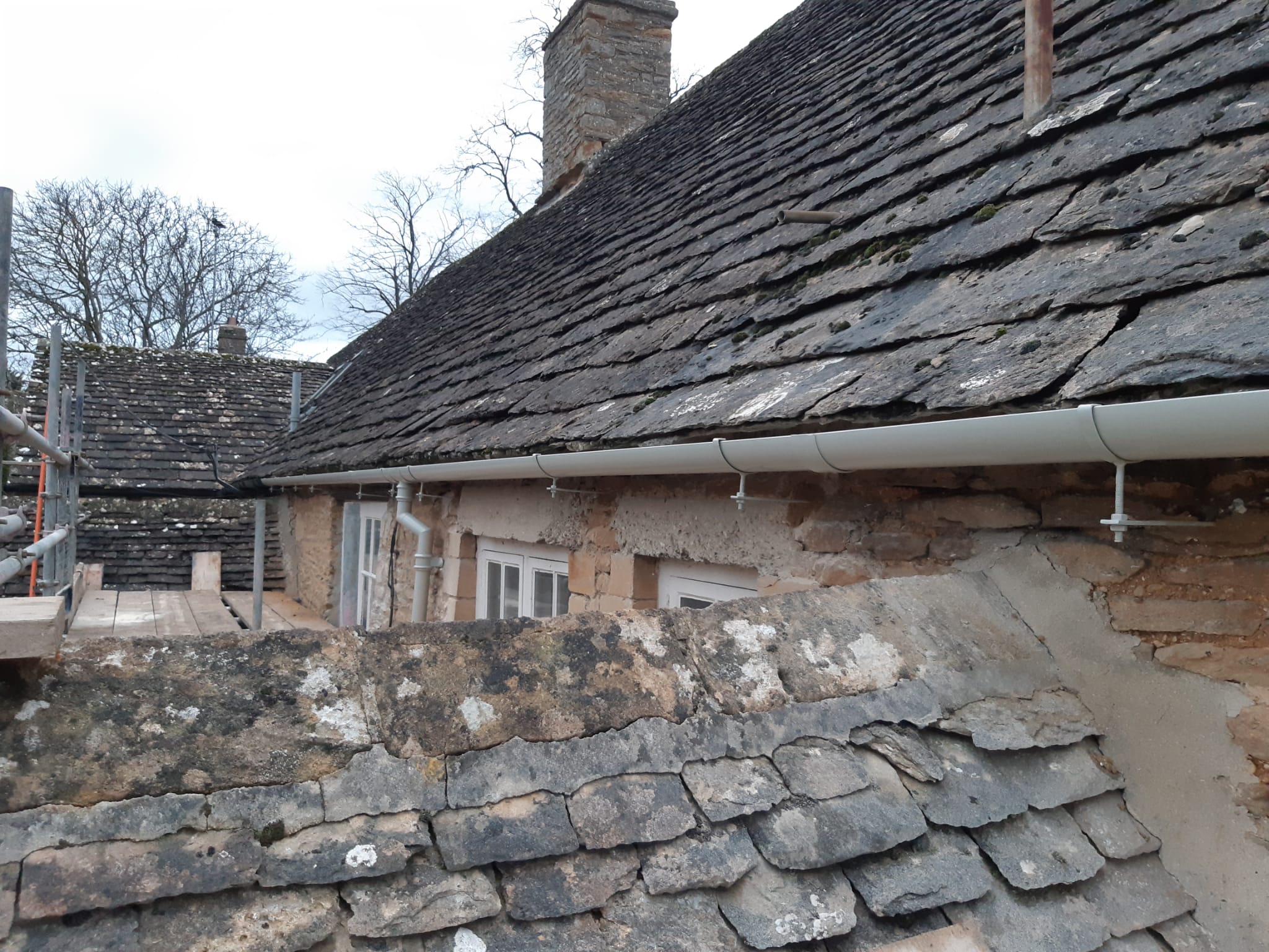 Aluminium guttering and downpipes installed on a cotswold stone property in filkins near witney