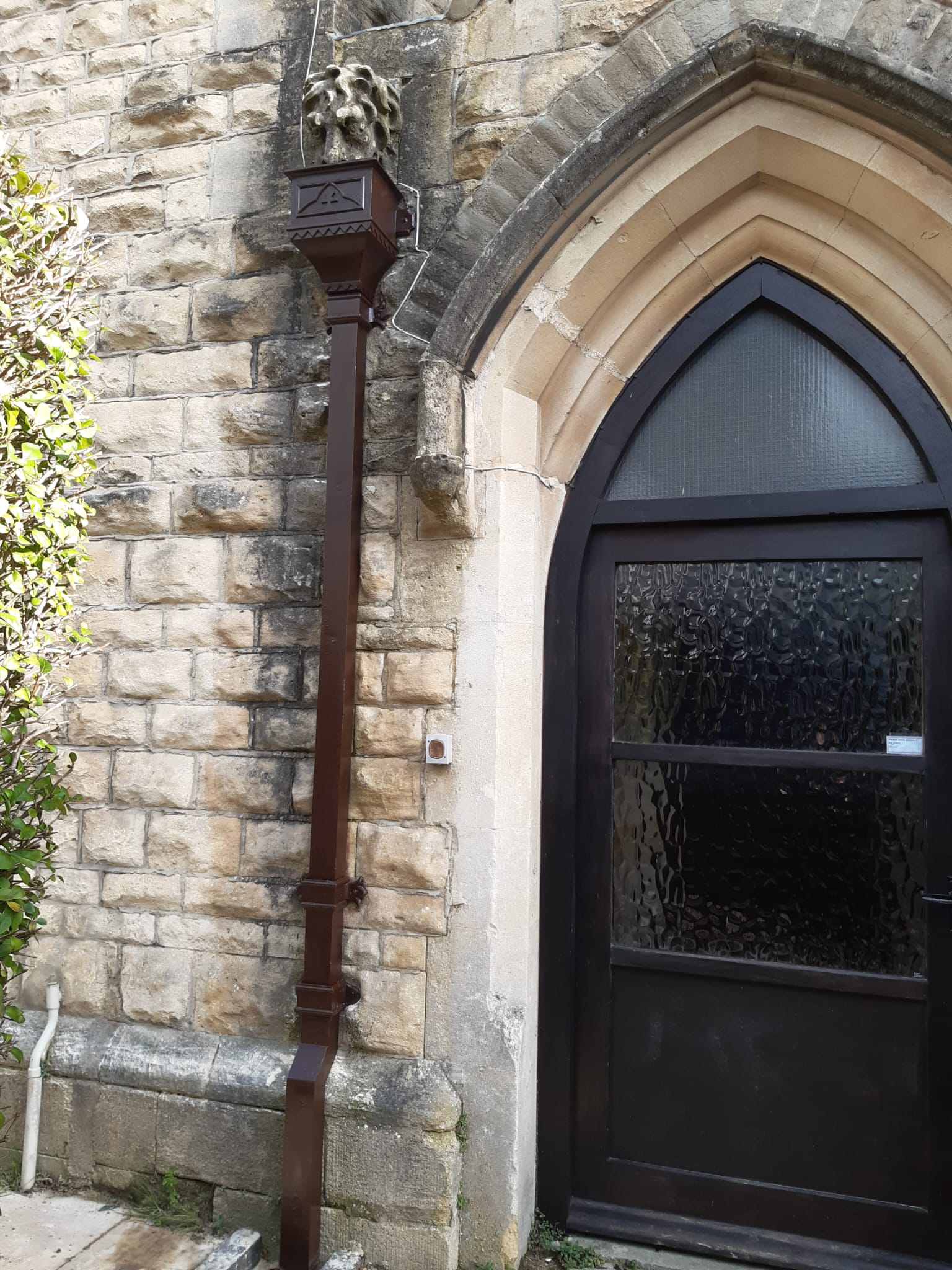Restoration of an old cast iron hopper and downpipe on a listed building in cheltenham