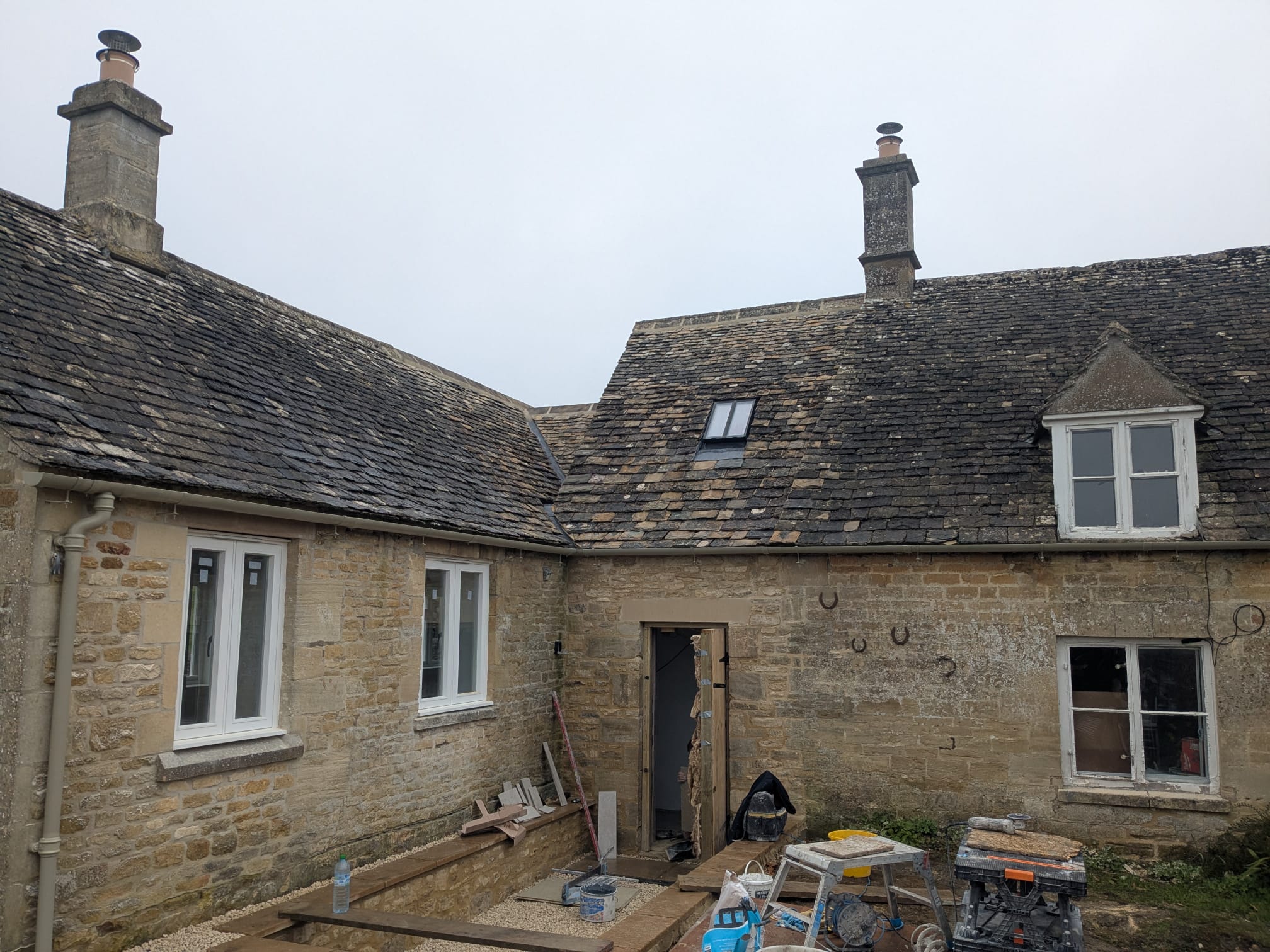 a run of cast iron guttering on rise and fall brackets near Burford