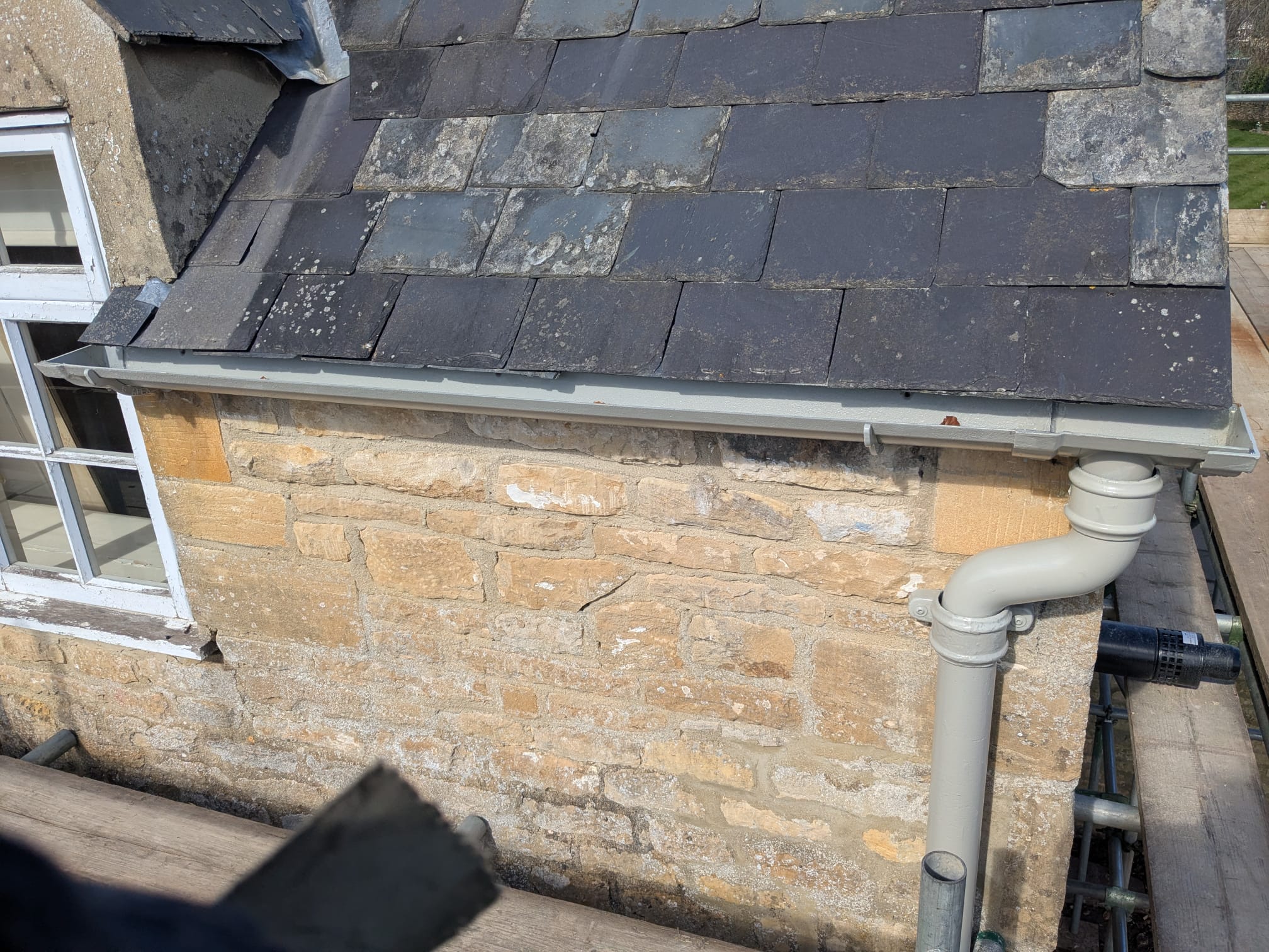 a short section of cast iron guttering and downpipe in fifield