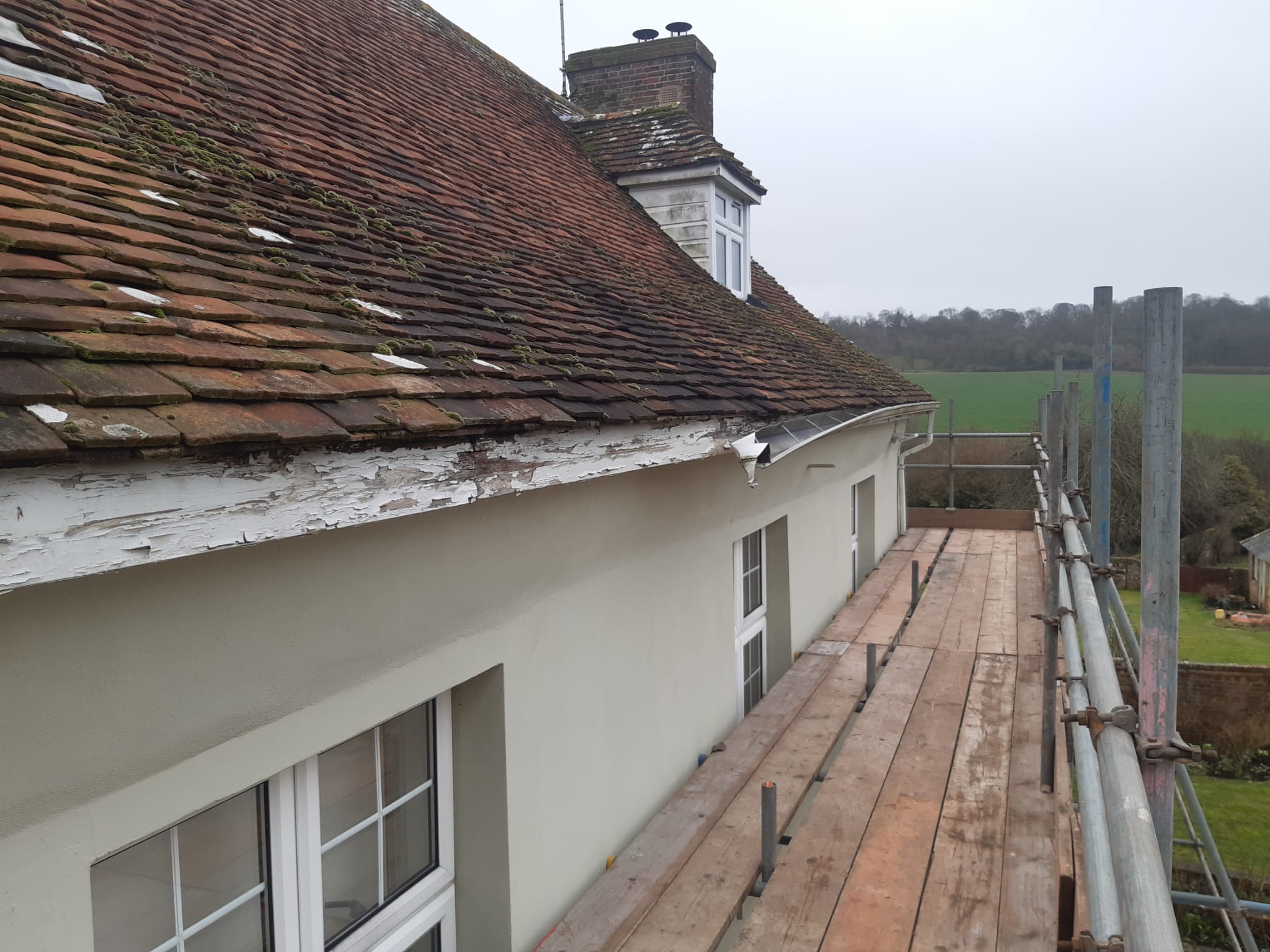 the old fascia with the seamless aluminium guttering cut away